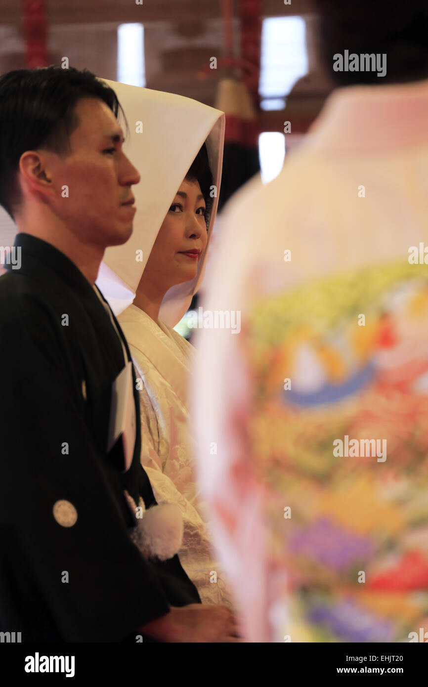 A Bride And Groom In Traditional Japanese Wedding Kimono In A Shinto