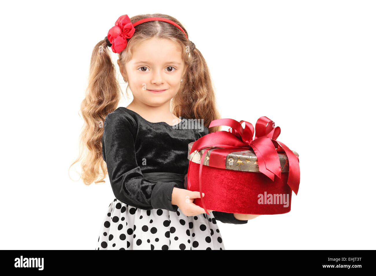 Cute little girl holding a present isolated on white background Stock ...