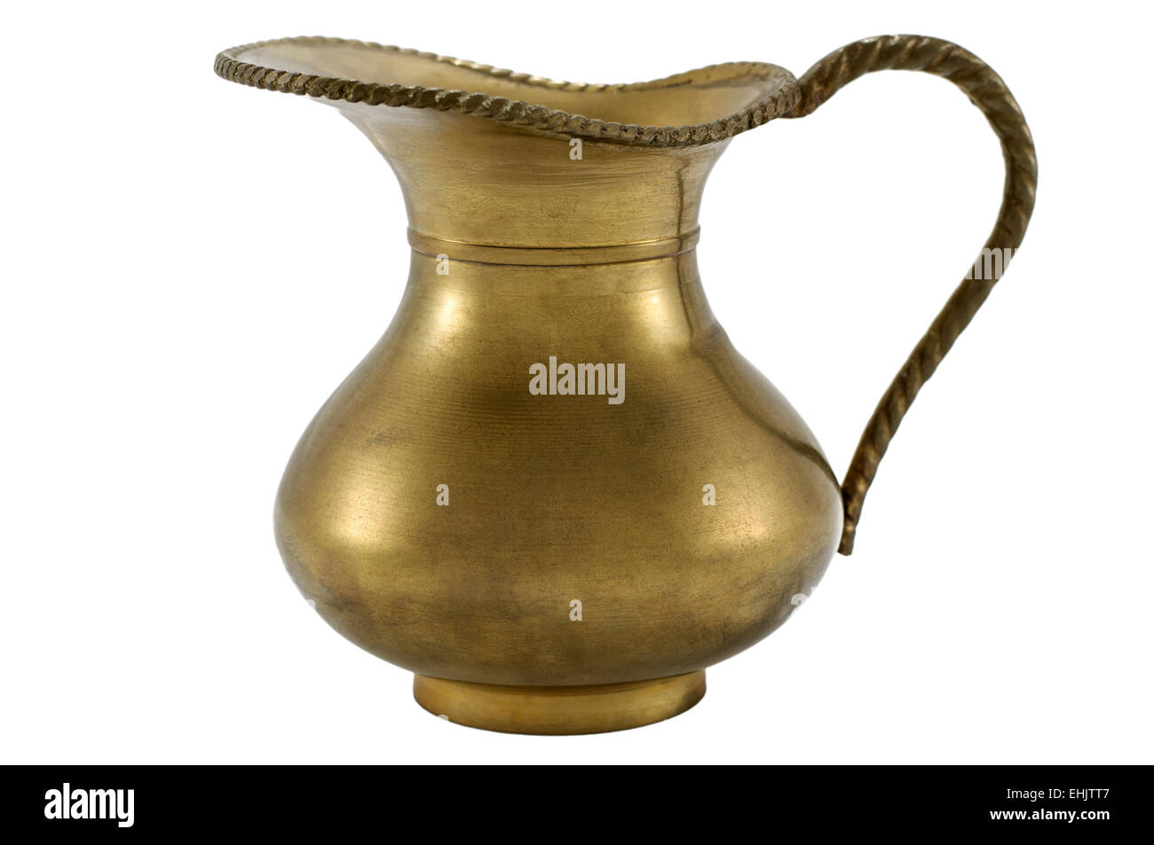 Antique indian brass pitcher isolated on white background Stock Photo -  Alamy