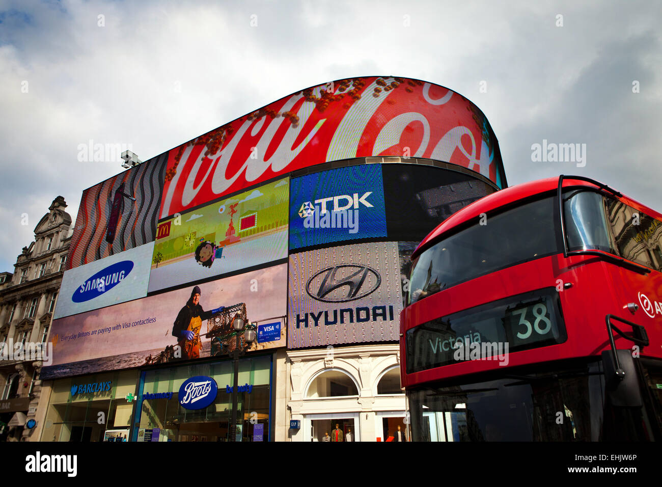 Neon advertising signs at London double decker bus, Piccadilly Circus, London Stock Photo