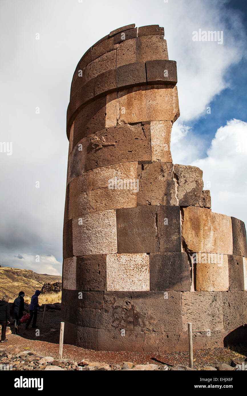 A few miles from Puno is the Sillustani Inca archaeological site featuring large Inca stone burial towers up to 35 feet high. Stock Photo