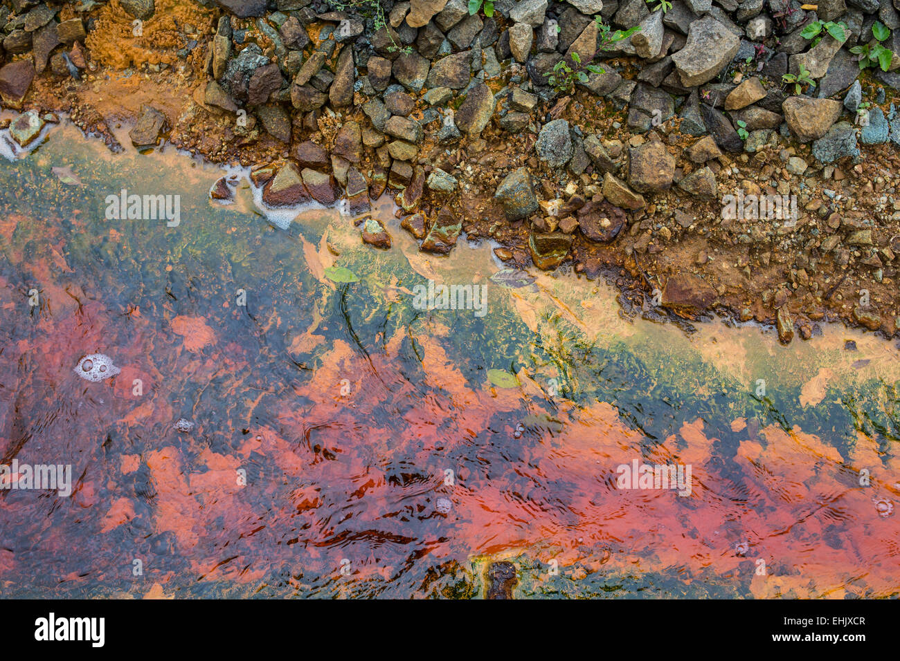 Polluted water coming out of a closed mine in Rosia Montana Romania Stock Photo