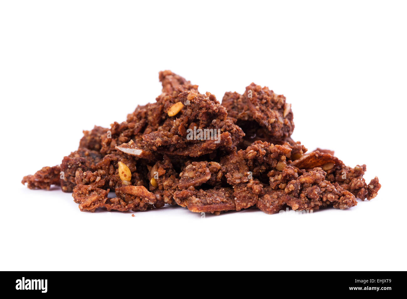Organic and raw cacao superfood crunchy cereal on white background. High content of nutrients. Stock Photo