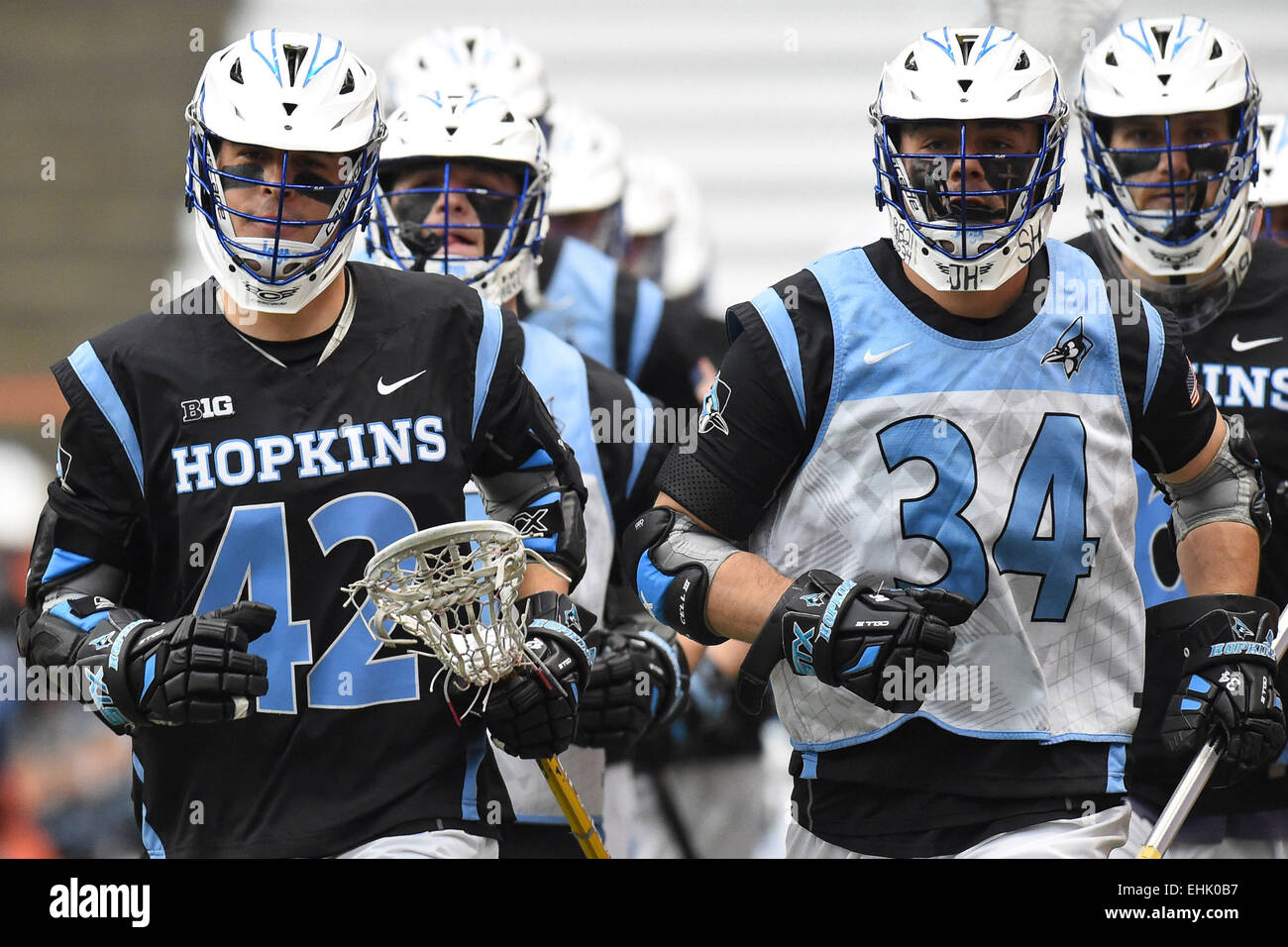 Syracuse, New York, USA. 14th Mar, 2015. Johns Hopkins Blue Jays attackman Wells Stanwick (42) and defenseman Michael Pellegrino (34) lead the team on the field prior to a NCAA men's lacrosse game between the Johns Hopkins Blue Jays and the Syracuse Orange at the Carrier Dome in Syracuse, New York. Syracuse defeated Johns Hopkins 13-10. Rich Barnes/CSM/Alamy Live News Stock Photo