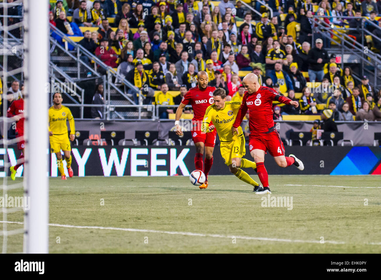 Columbus Crew SC midfielder Ethan Finlay (13) charging the goal with Toronto FC midfielder Michael Bradley (4) defending during the match between Toronto FC and Columbus Crew SC at MAPFRE Stadium, in Columbus OH. on March 14, 2015. Photo: Dorn Byg/CSM Stock Photo
