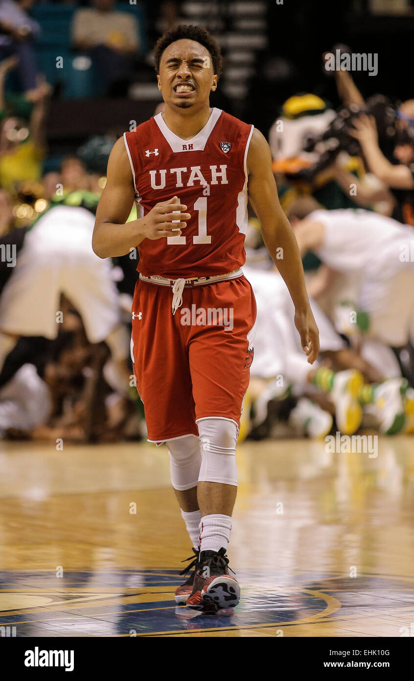 Las Vegas, NV, USA. 13th Mar, 2015. Utah G # 11 Brandon Taylor show disapointment over a 3 point lost while Oregon celebrite there win in the background during NCAA Pac 12 Men's Basketball Tournament between Utah Utes and Oregon Ducks 64-67 lost at MGM Grand Garden Arena Las Vegas, NV Credit:  csm/Alamy Live News Stock Photo