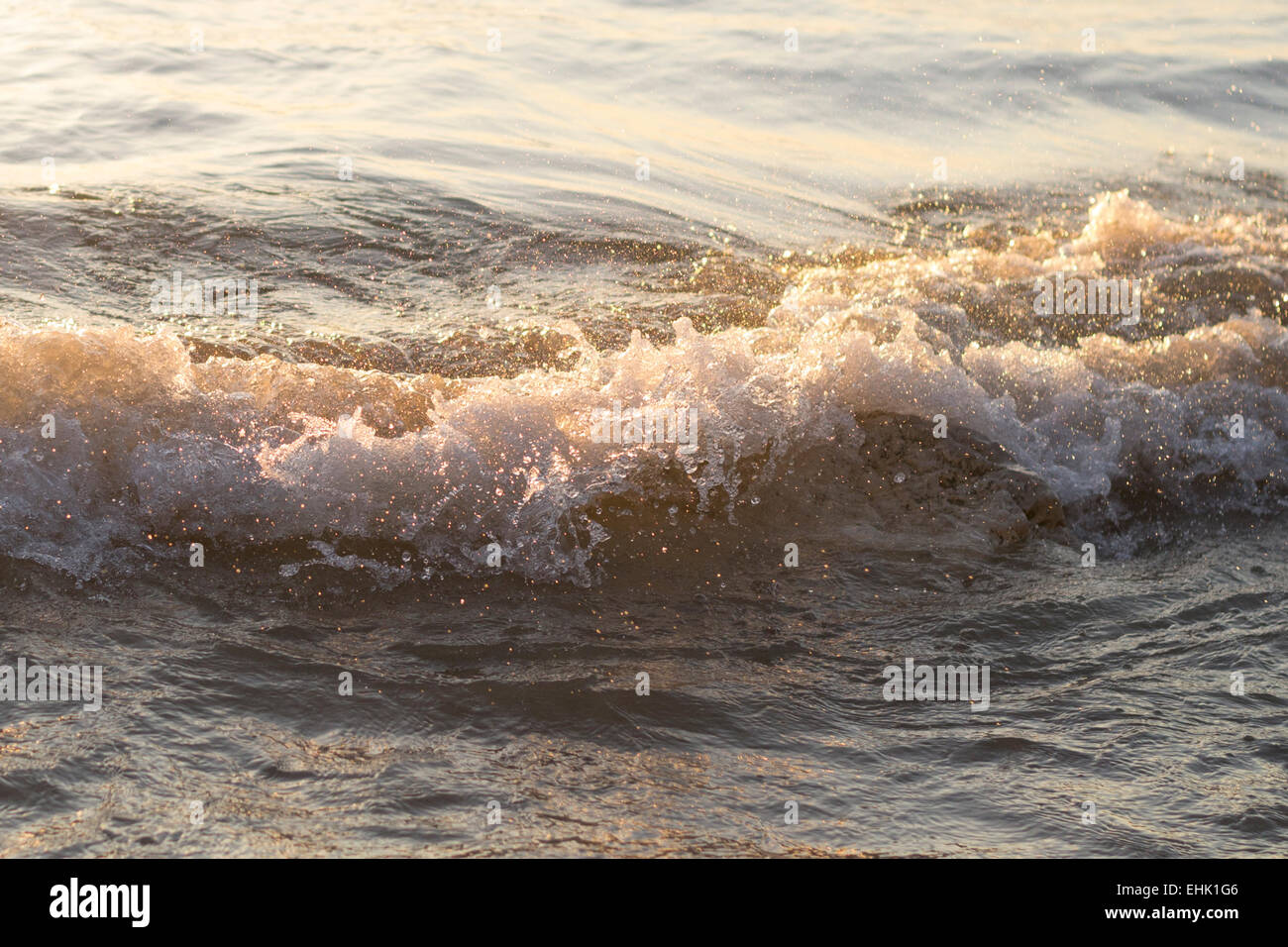 Warm waves splashing splash water frozen motion on beach Lake Michigan Chicago IL Stock Photo
