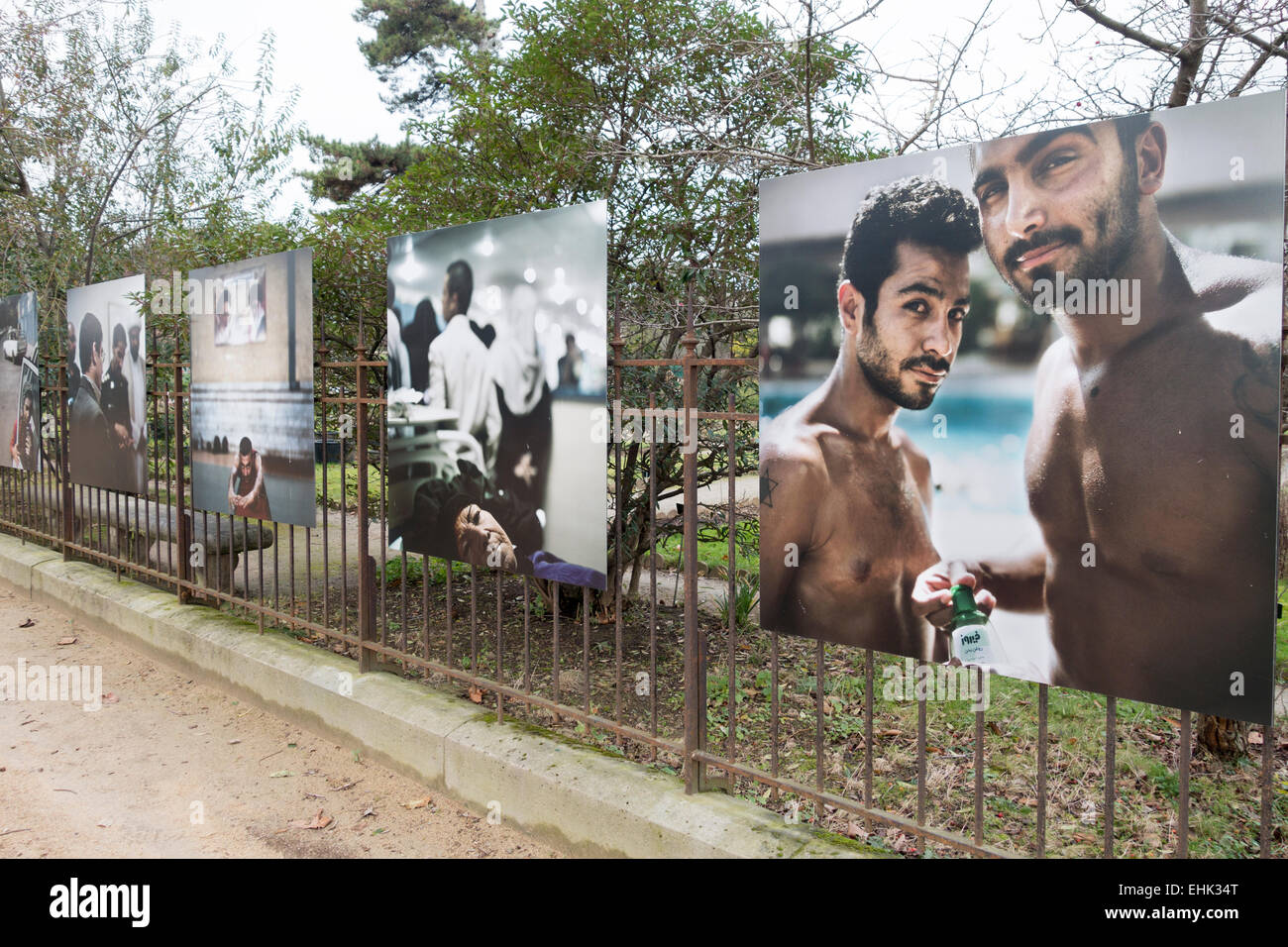 Outdoor photography exhibition on the iron railings of the Jardin des Plantes, Paris Stock Photo