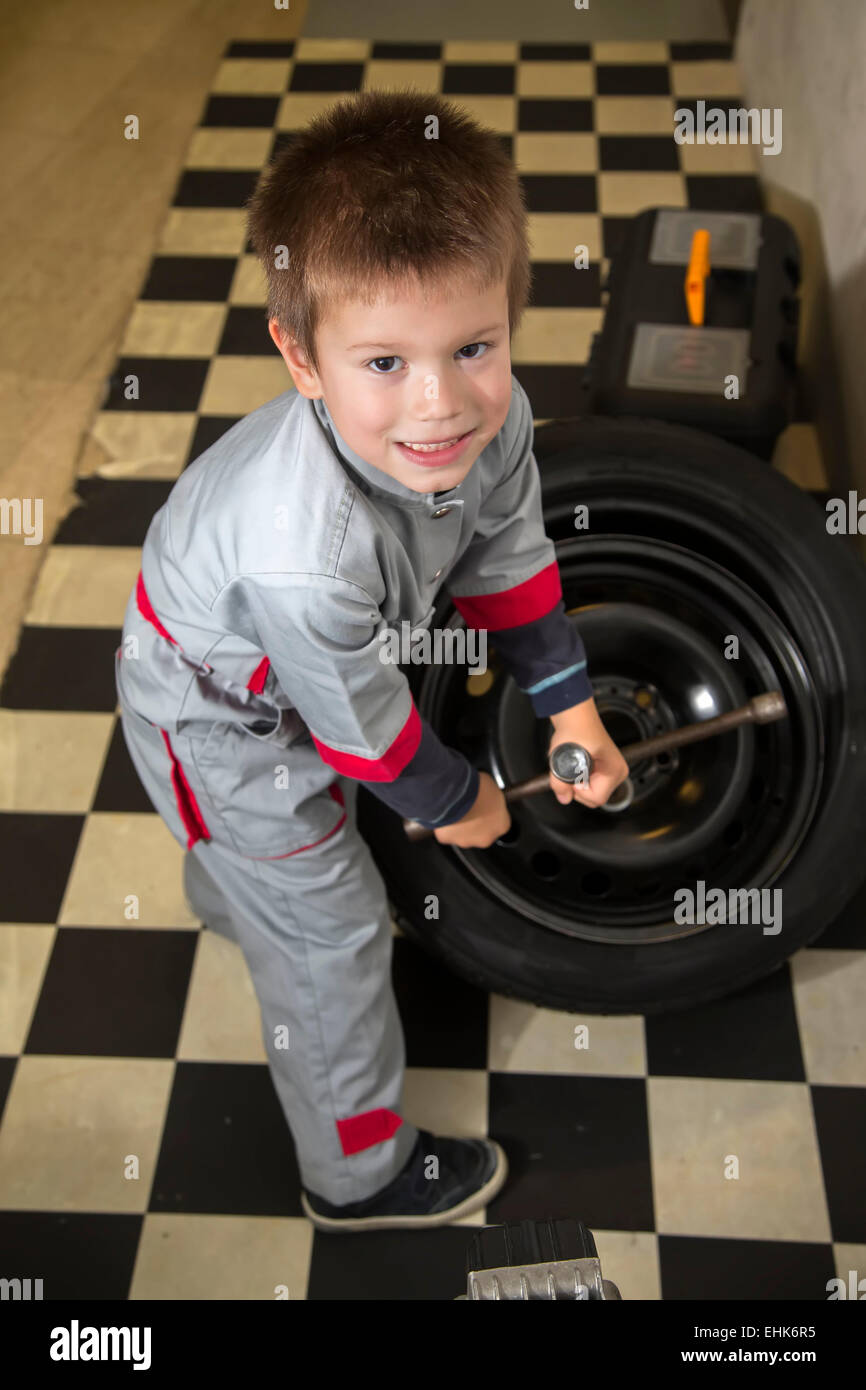 Boy in the auto repair shop Stock Photo Alamy