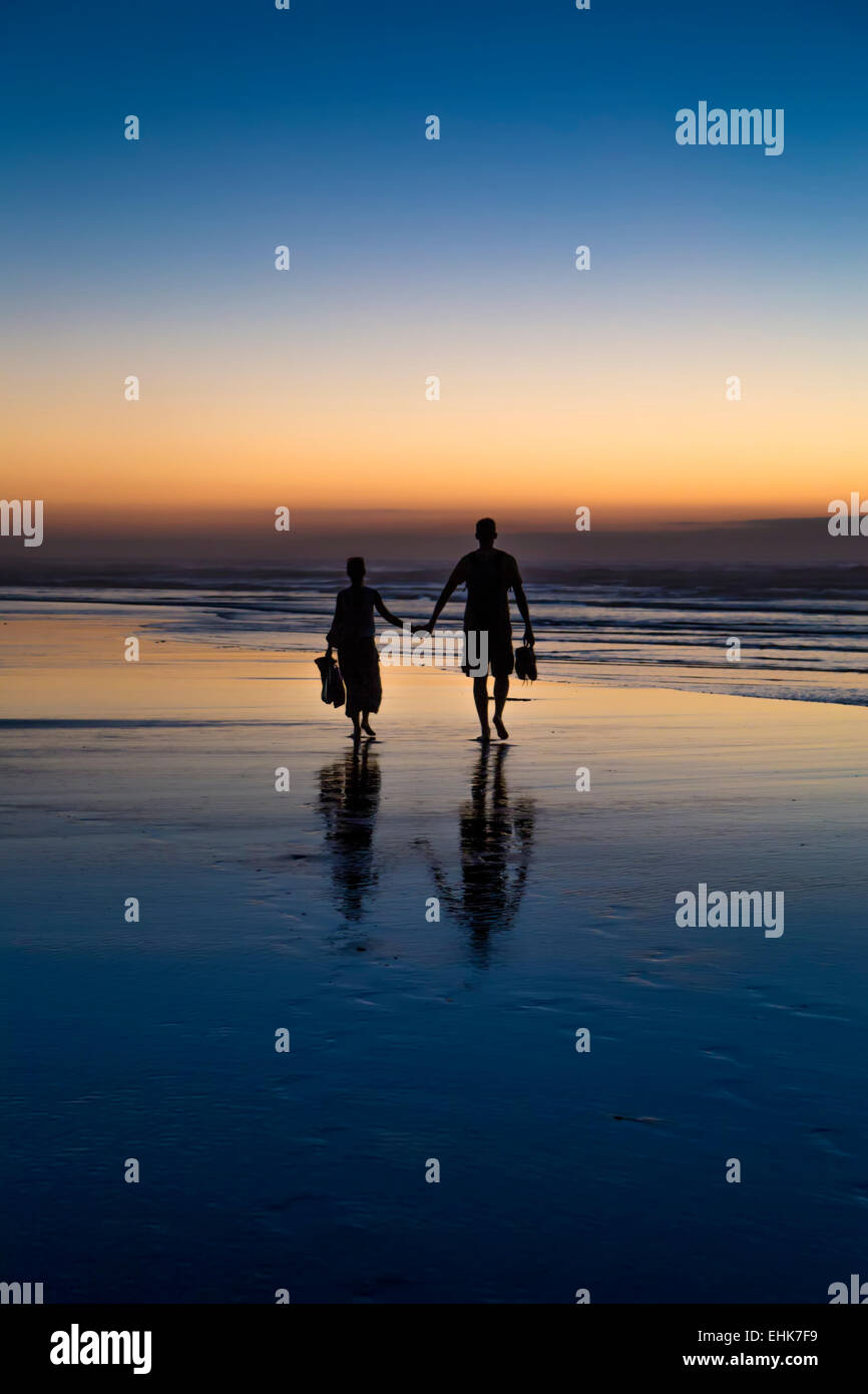 Couple at sunset Stock Photo - Alamy