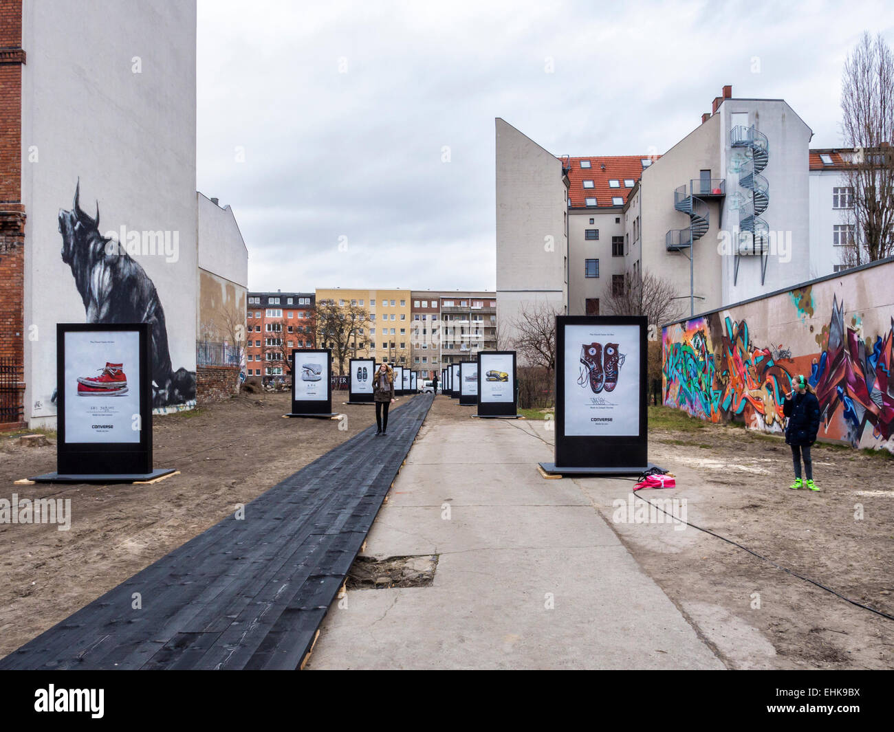 Berlin Converse Trainers Advertisement, Chucks shoes 'made for you' campaign catwalk and street art murals Stock Photo