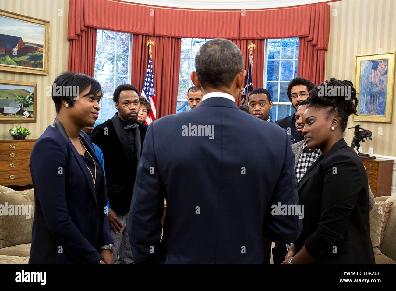 US President Barack Obama meets with young local and national civil rights leaders in the Oval Office of the White House December 1, 2014 in Washington, DC. Stock Photo