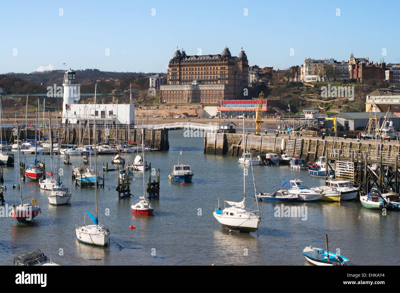 Scarborough harbour with the lighthouse and Grand Hotel in the background, North Yorkshire, UK Stock Photo