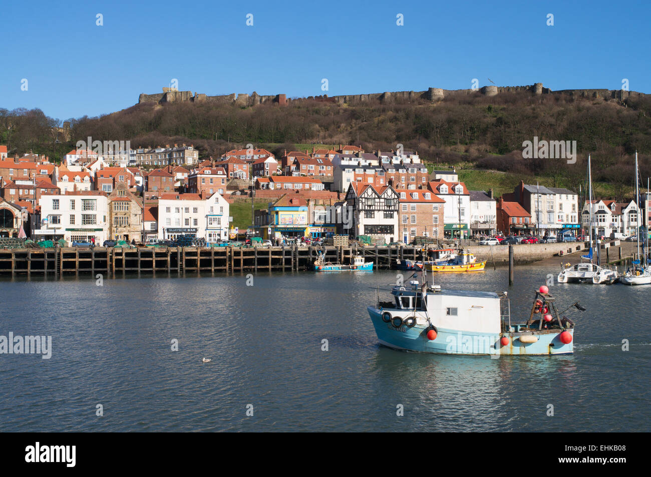 Fishing boat entering a harbor hi-res stock photography and images - Alamy