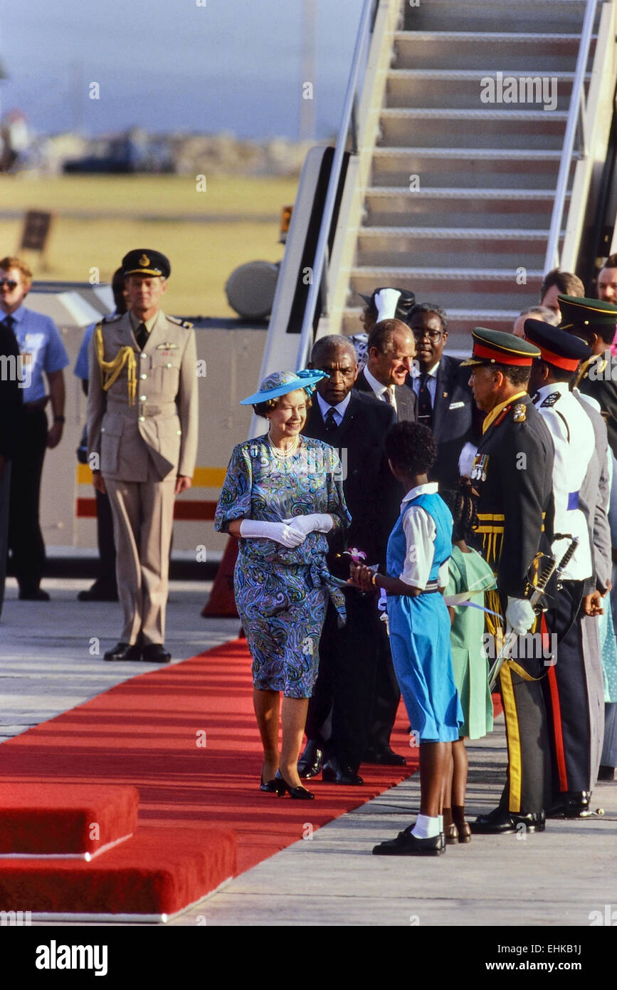 Queen Elizabeth II on the red carpet at the start of a four-day trip to Barbados. 8-11th March 1989 Stock Photo