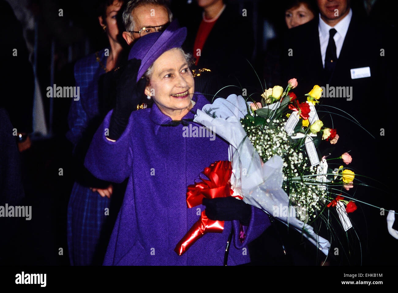 A smiling HRH Queen Elizabeth II wearing a purple / violet matching outfit. London, England, UK.  Circa 1980's Stock Photo