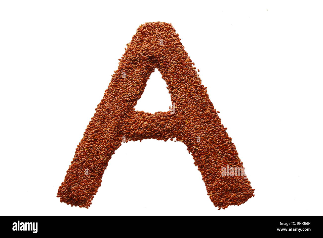 flax seed laid the letter a on a white background Stock Photo - Alamy