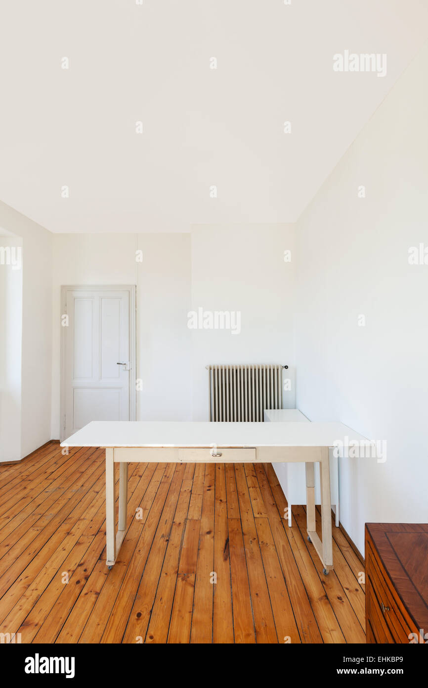home interior, view table in a room with white walls Stock Photo