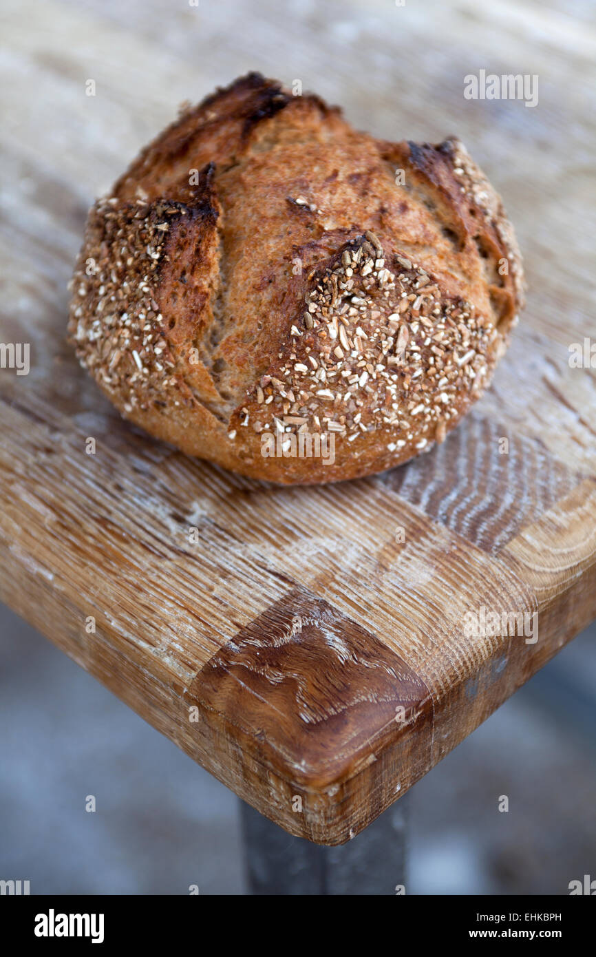 A round loaf of freshly baked wholemeal bread Stock Photo