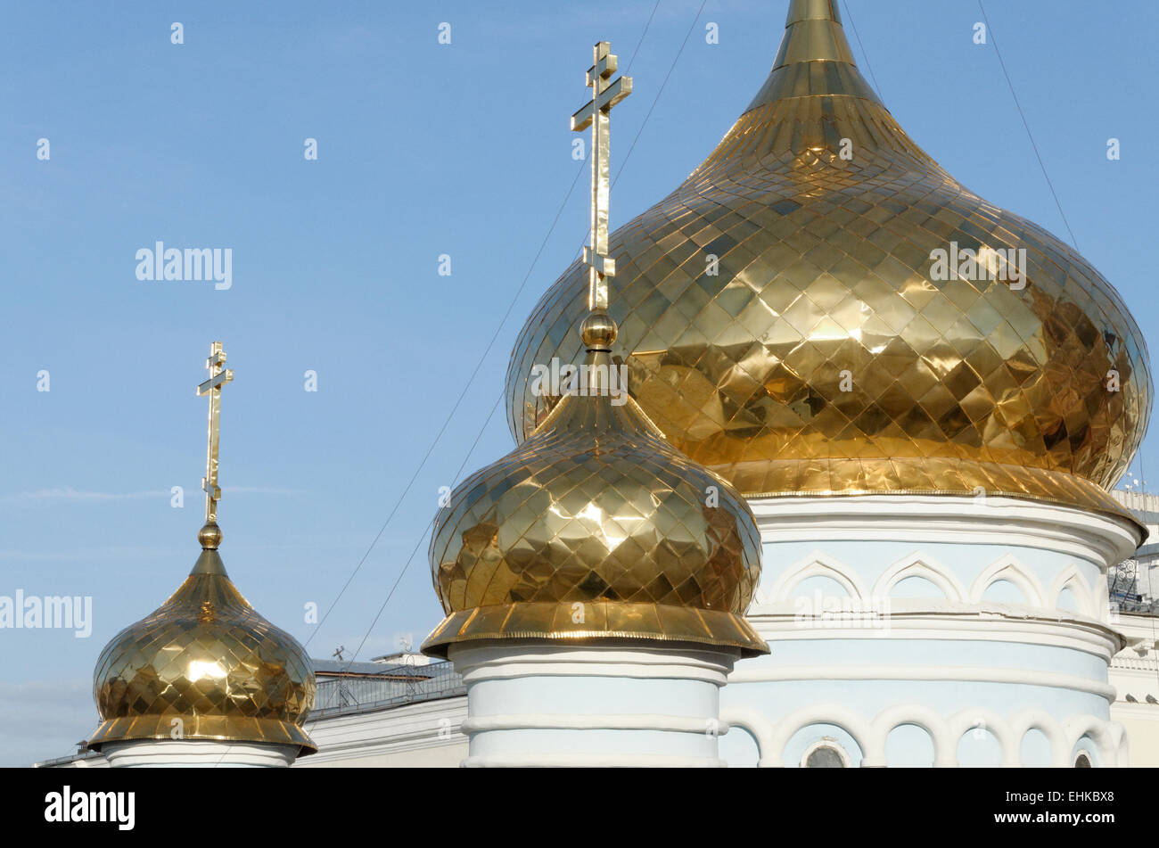 Traditional golden onion domes cupolas on a Russian church. Stock Photo