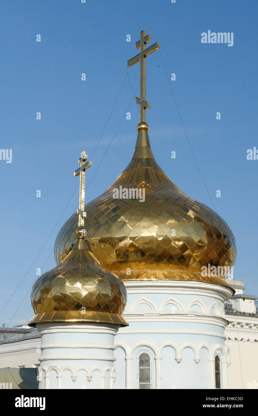 Traditional golden onion domes cupolas on a Russian church. Stock Photo