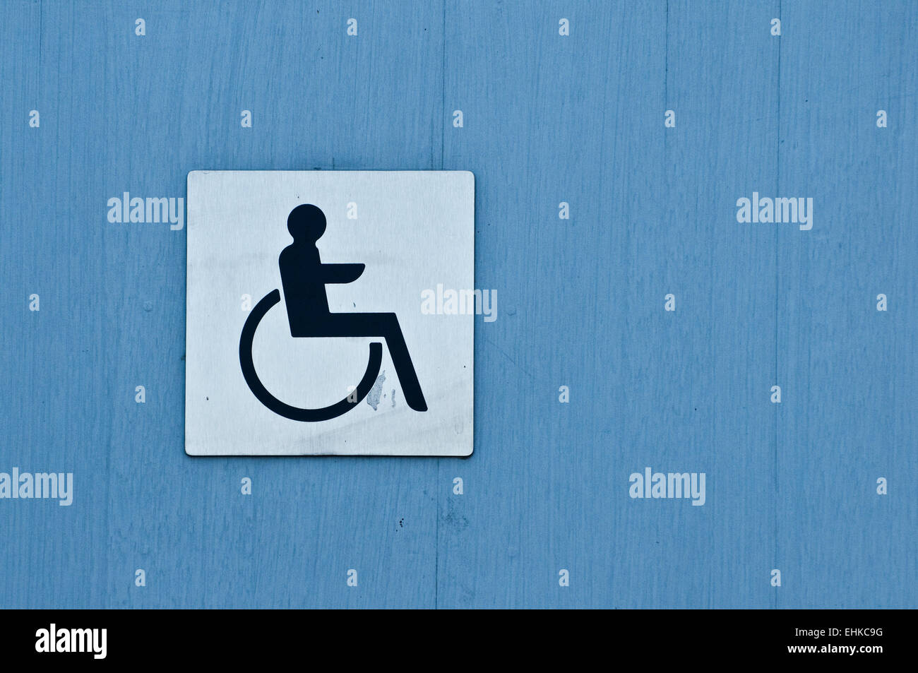 disabled sign on the door of a public toilet Stock Photo