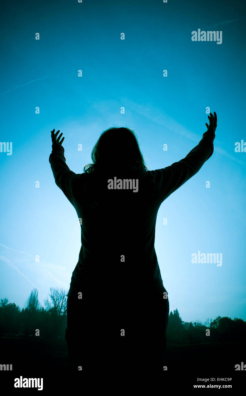 Silhouette woman open arms hi-res stock photography and images - Alamy