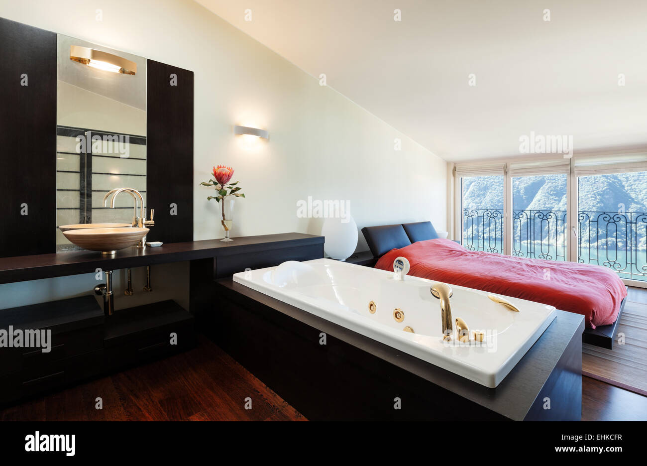 interior luxury apartment, beautiful bedroom with jacuzzi Stock Photo