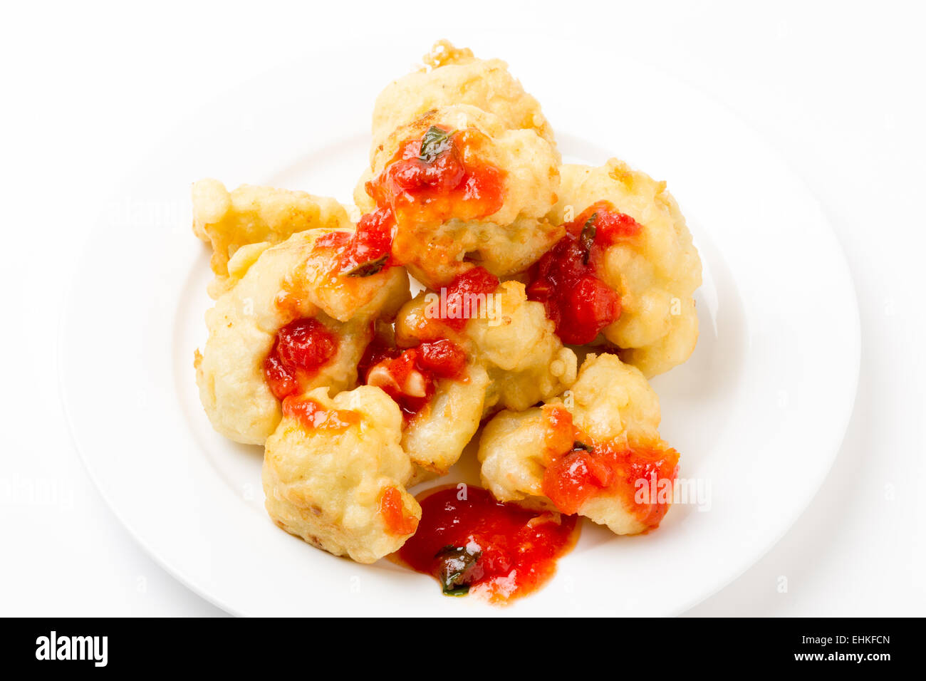 Florets of cauliflower parboiled then dipped in batter and deep fried Stock Photo