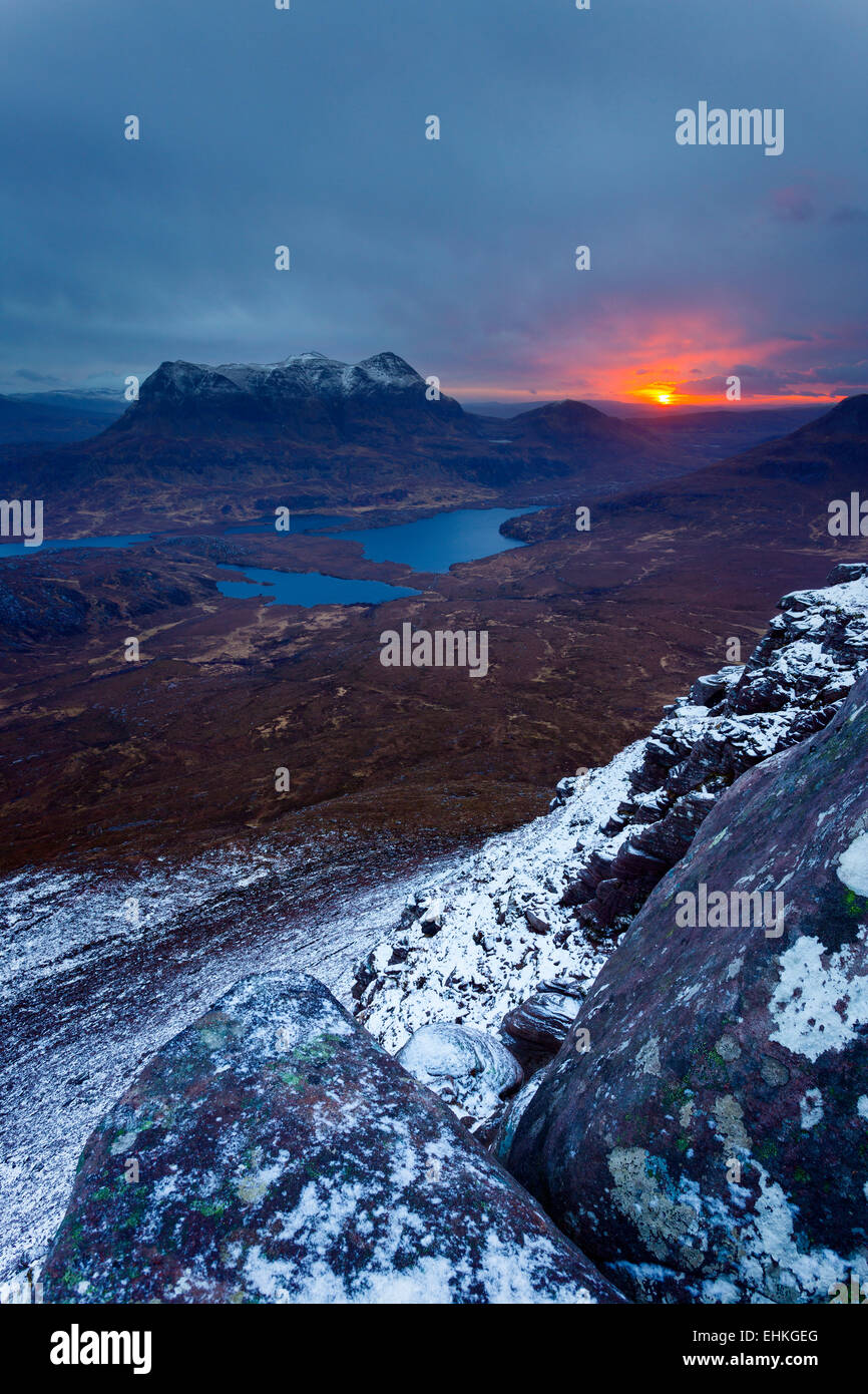 Cul Mor seen from the snow-covered slopes of Stac Pollaidh at sunrise Stock Photo