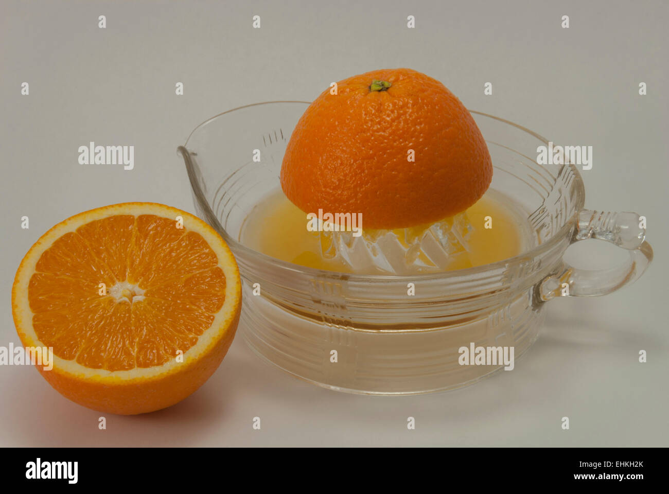 Oranges to Orange Juice. The whole fruit to homemade juice Stock Photo