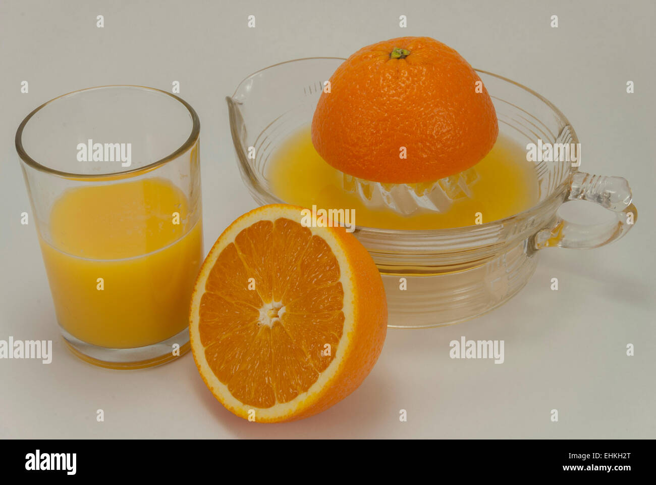 Oranges to Orange Juice. The whole fruit to homemade juice Stock Photo