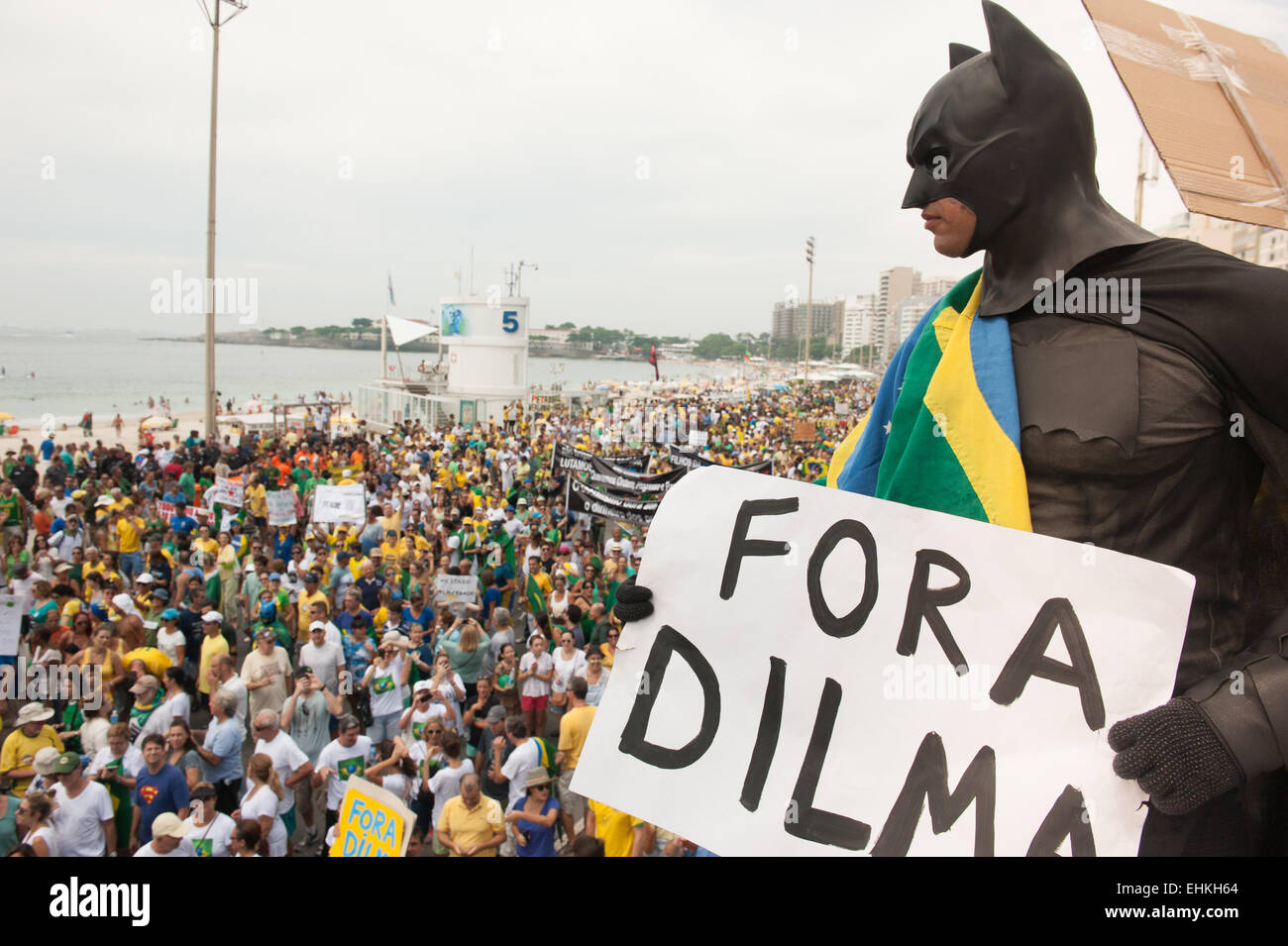 Protestor dressed in a Batman costume with placard saying 'FORA DILMA' (Dilma Out). Rio de Janeiro, Brazil. Demonstration against President Dilma Rousseff. Stock Photo