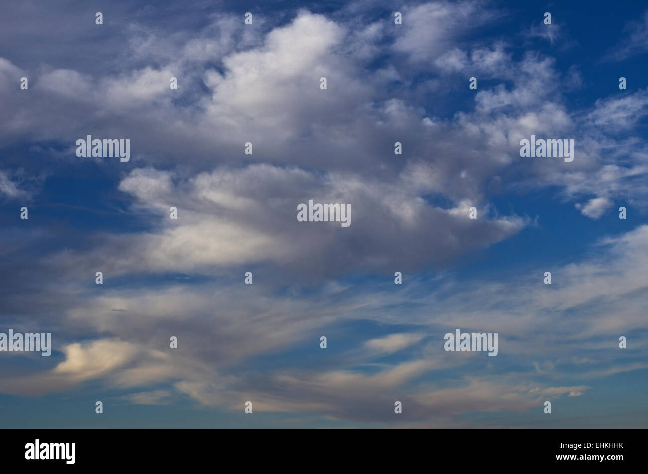 Fluffy white cumulus clouds in a blue sky Stock Photo - Alamy