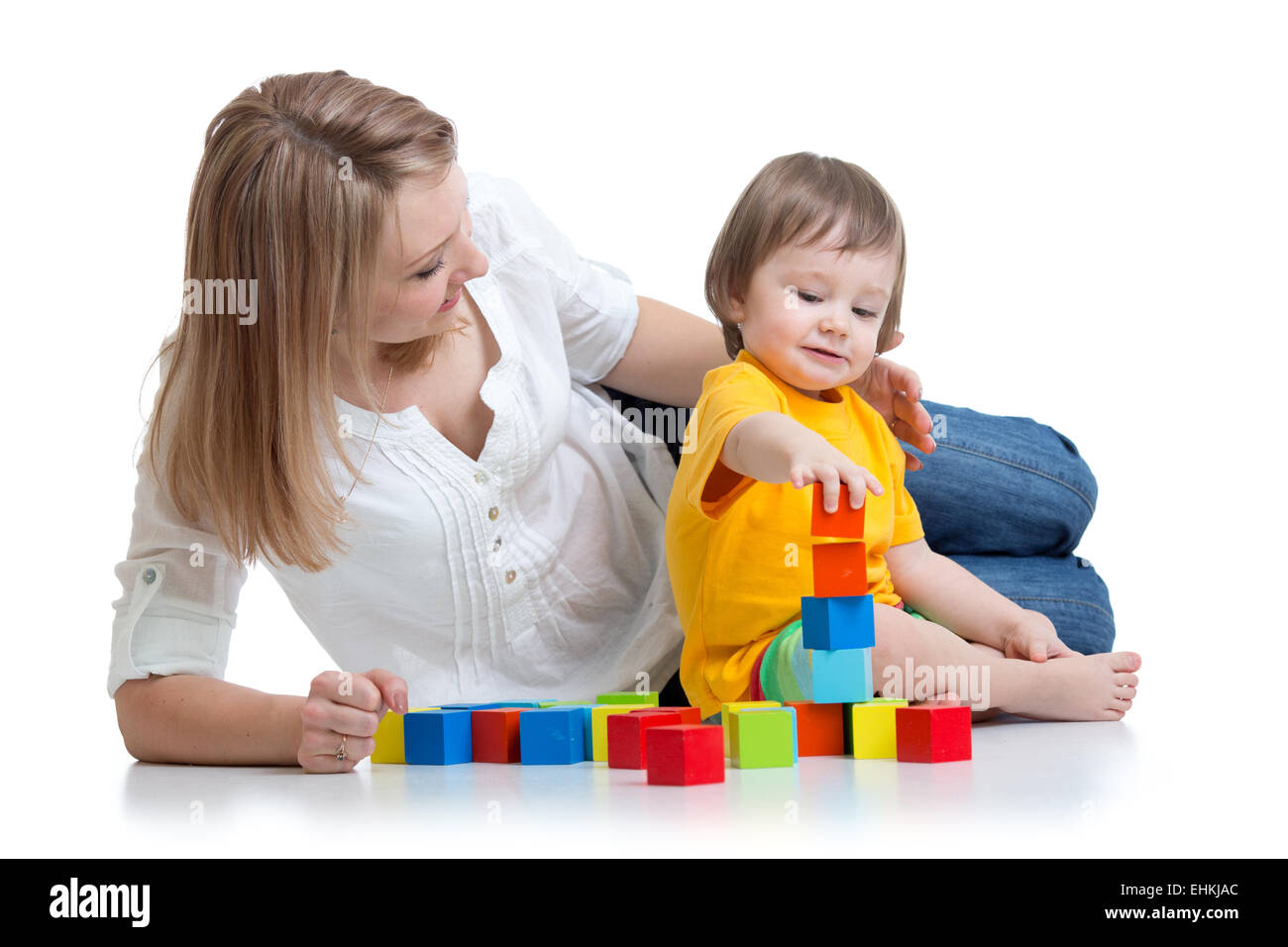 kid boy and mother play together with construction set toy Stock Photo