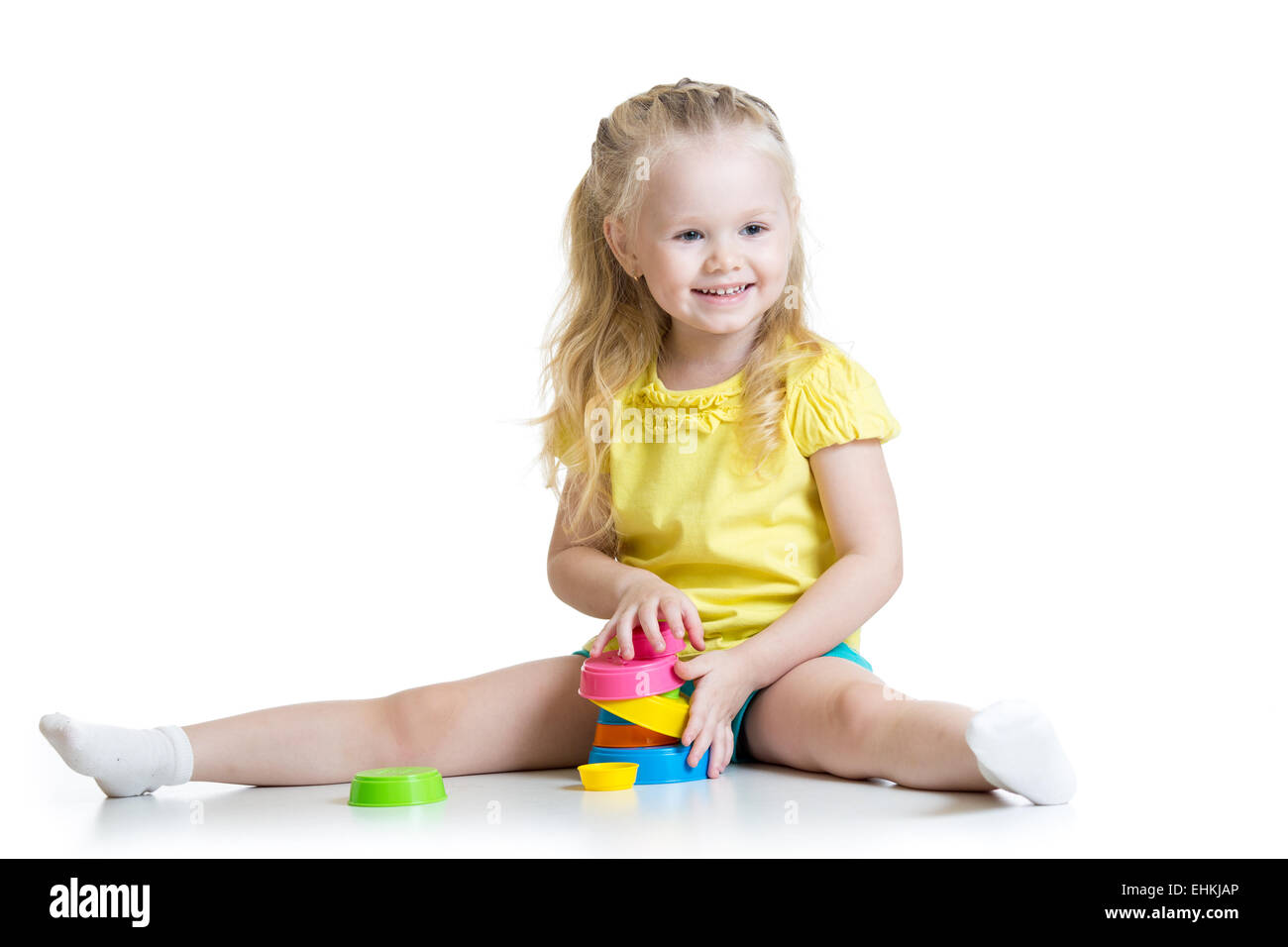 child little girl playing with color toys Stock Photo
