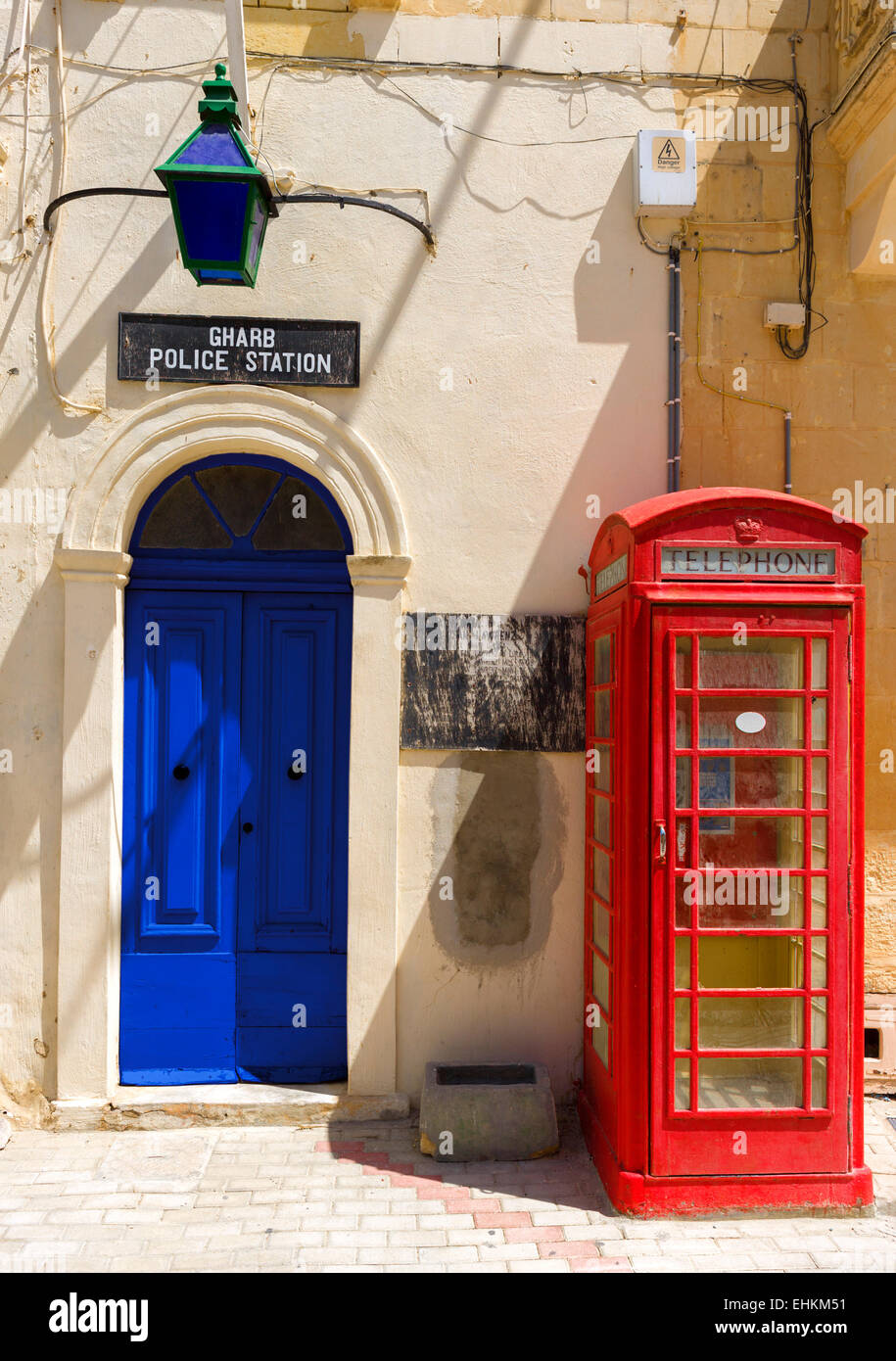 Police Station and old phone box, Main Square, Gharb, Gozo, Malta Stock Photo
