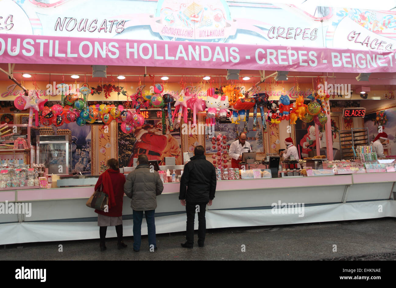 Street stall making & selling local sweets, pancakes, waffles and  doughnuts, Lille, Nord, France Stock Photo