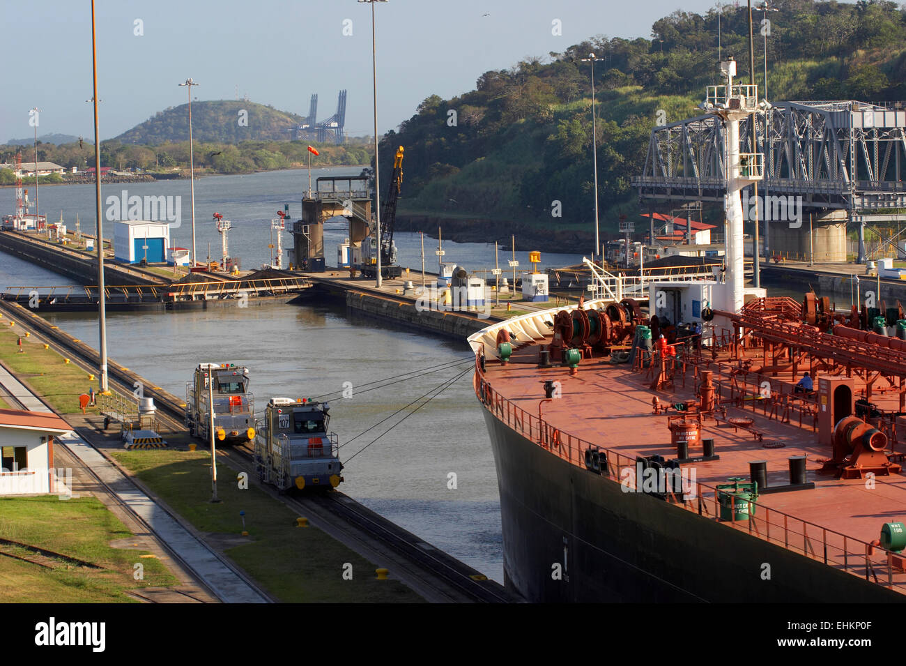 The Panama Canal Mules are small electric locomotives that help centering the ships in the middle of the locks. The ships are pr Stock Photo