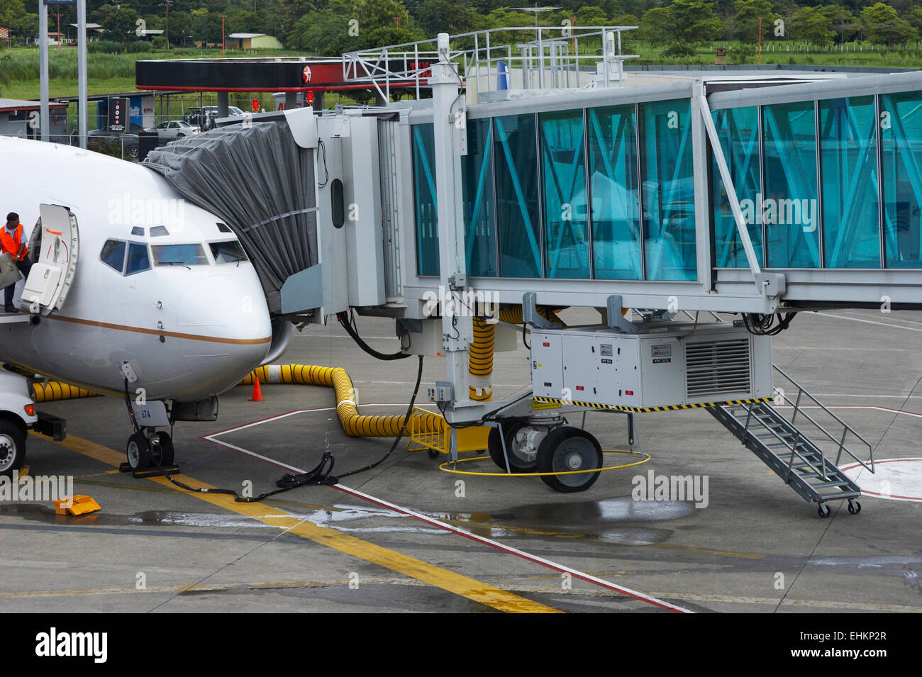 Airplane at docking station Stock Photo Alamy