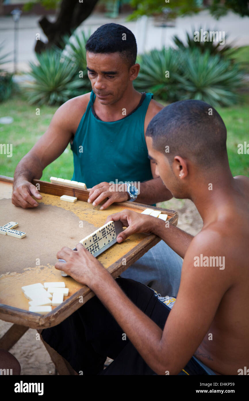 Men play dominoes in Trinidad, Cuba Stock Photo