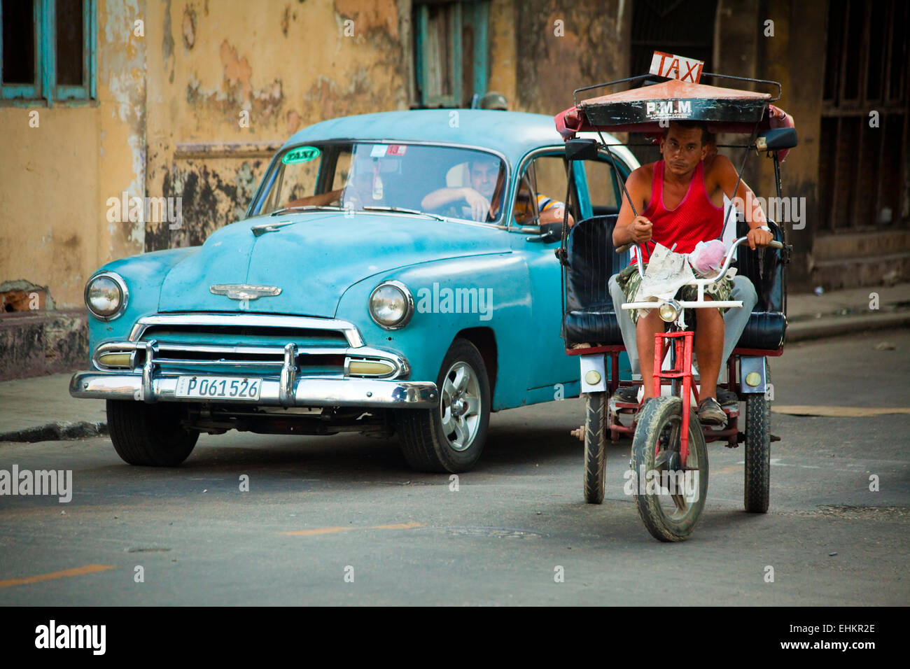 Classic car and bicycle taxi, Havana, Cuba Stock Photo