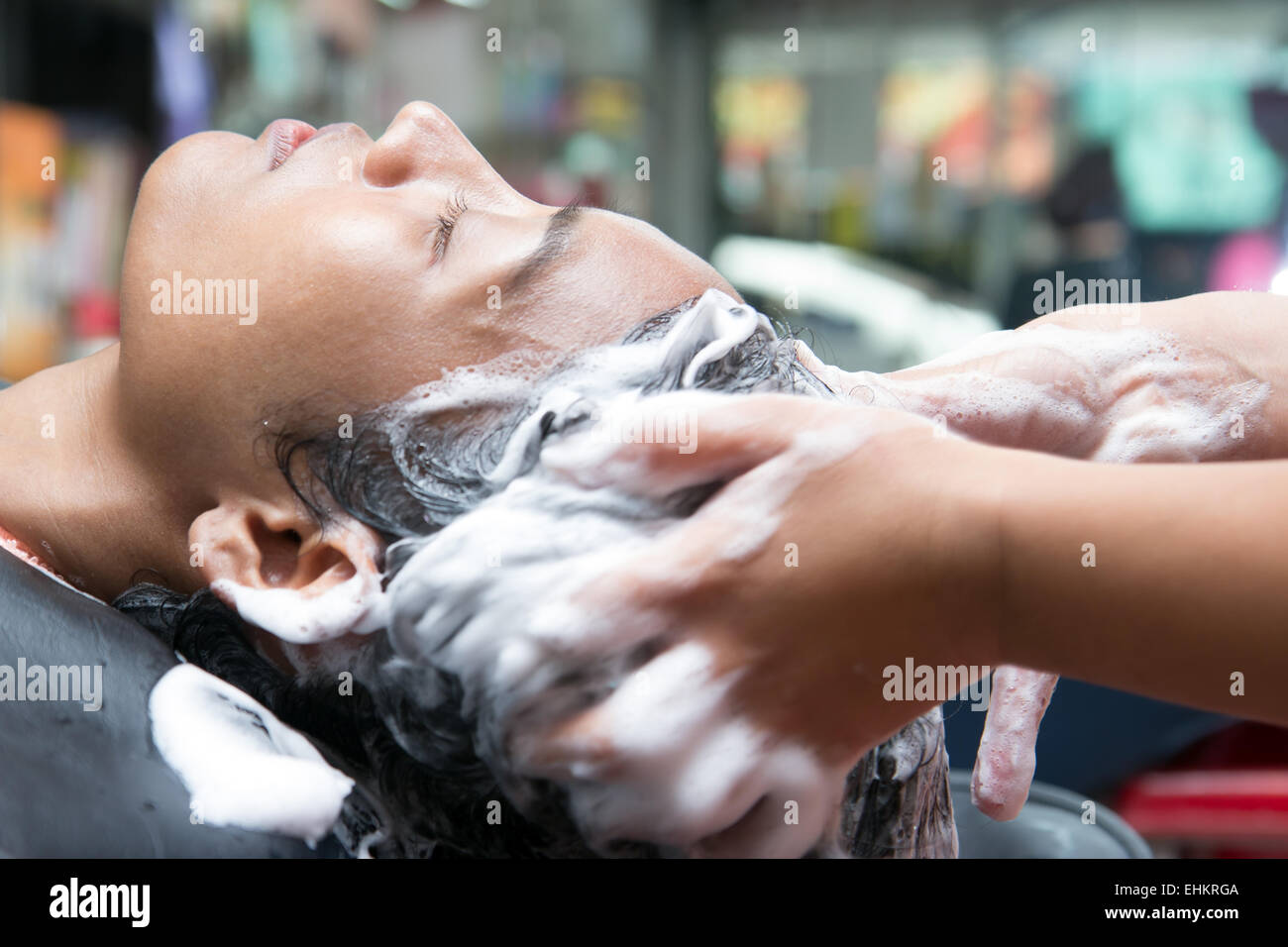 woman washing hair in salon Stock Photo