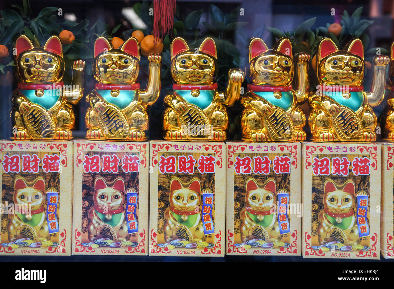 Lucky fortune cats, Maneki Neko, the beckoning lucky cat, for sale in shop Stock Photo