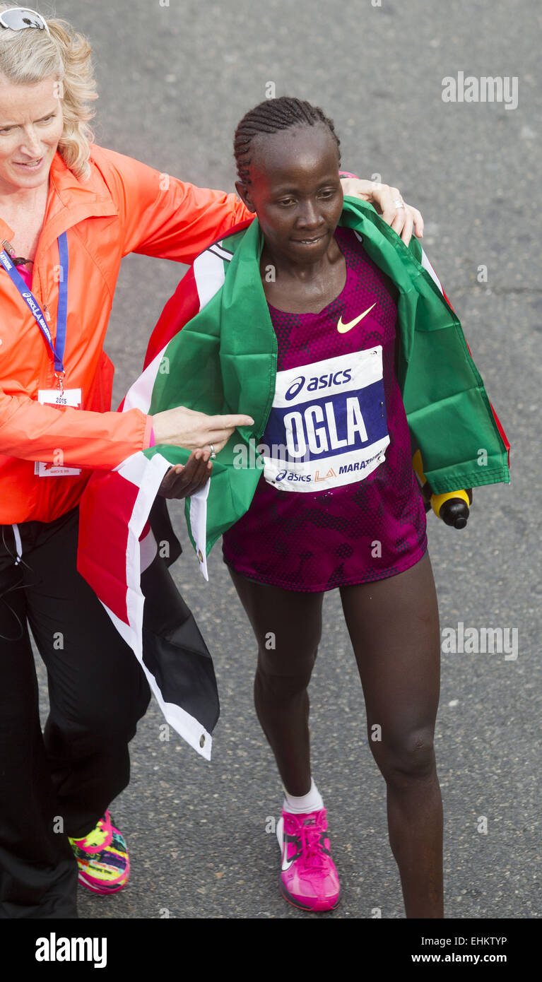 Los Angeles, California, USA. 15th Mar, 2015. Tracey Russell, CEO, Asics  L.A. Marathon, left, walks Olga Kimaiyo of Kenya, as she wins the women's  elite race of the 30th LA Marathon in