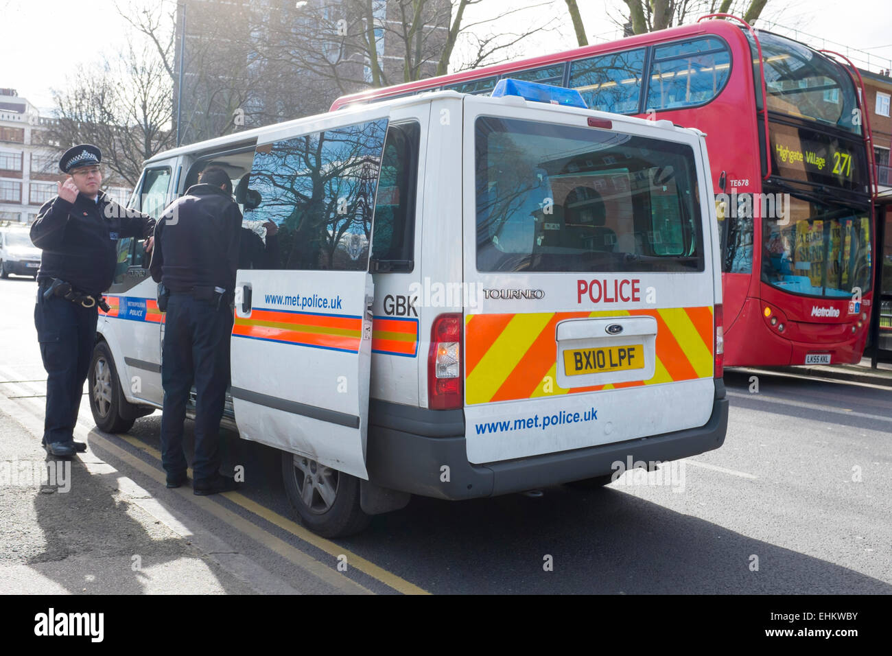 Close-up of police van with police officers, London, UK Stock Photo
