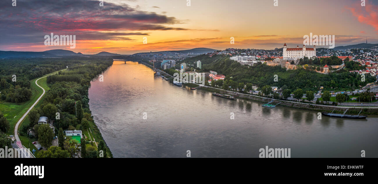 Castle of Bratislava on the Right Bank of Danube River at Sunset Stock Photo