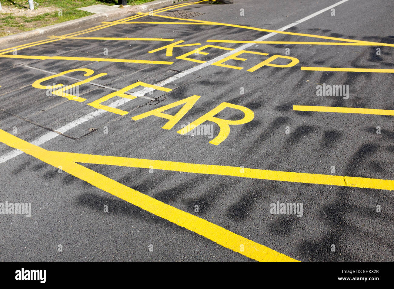 UK yellow keep clear painted parking restriction sign Stock Photo Alamy