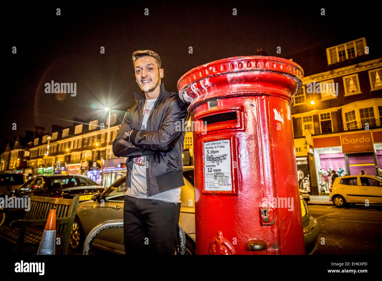 Mesut Özil, German footballer and Arsenal player poses by London red postbox. Stock Photo