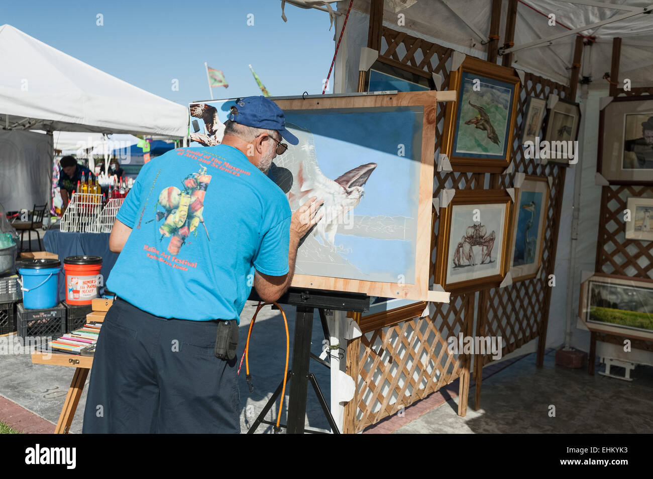 An Artist using chalk on a drawing at an event in Tavares, Florida sets ...
